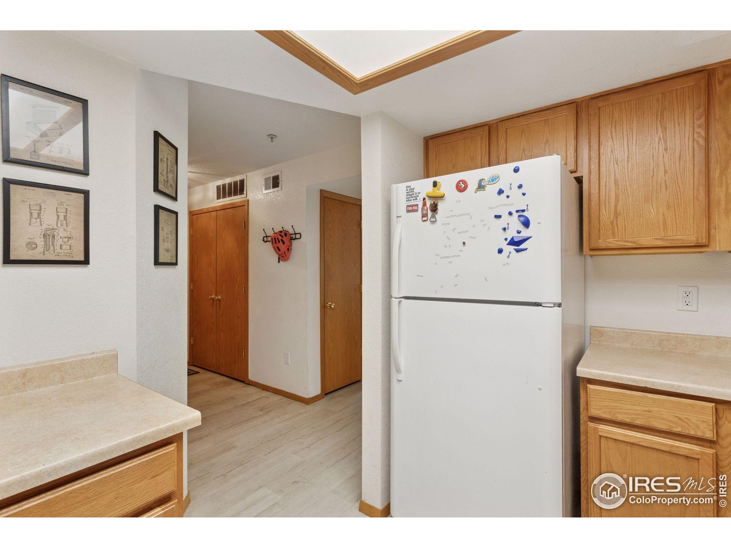 2802 Sundown Lane, Unit 102 Boulder, CO 80303 - Photo 11 of 41 a white refrigerator freezer sitting inside of a kitchen