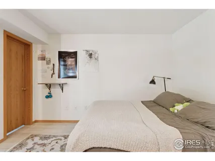 a bedroom with a bed and a view of bathroom