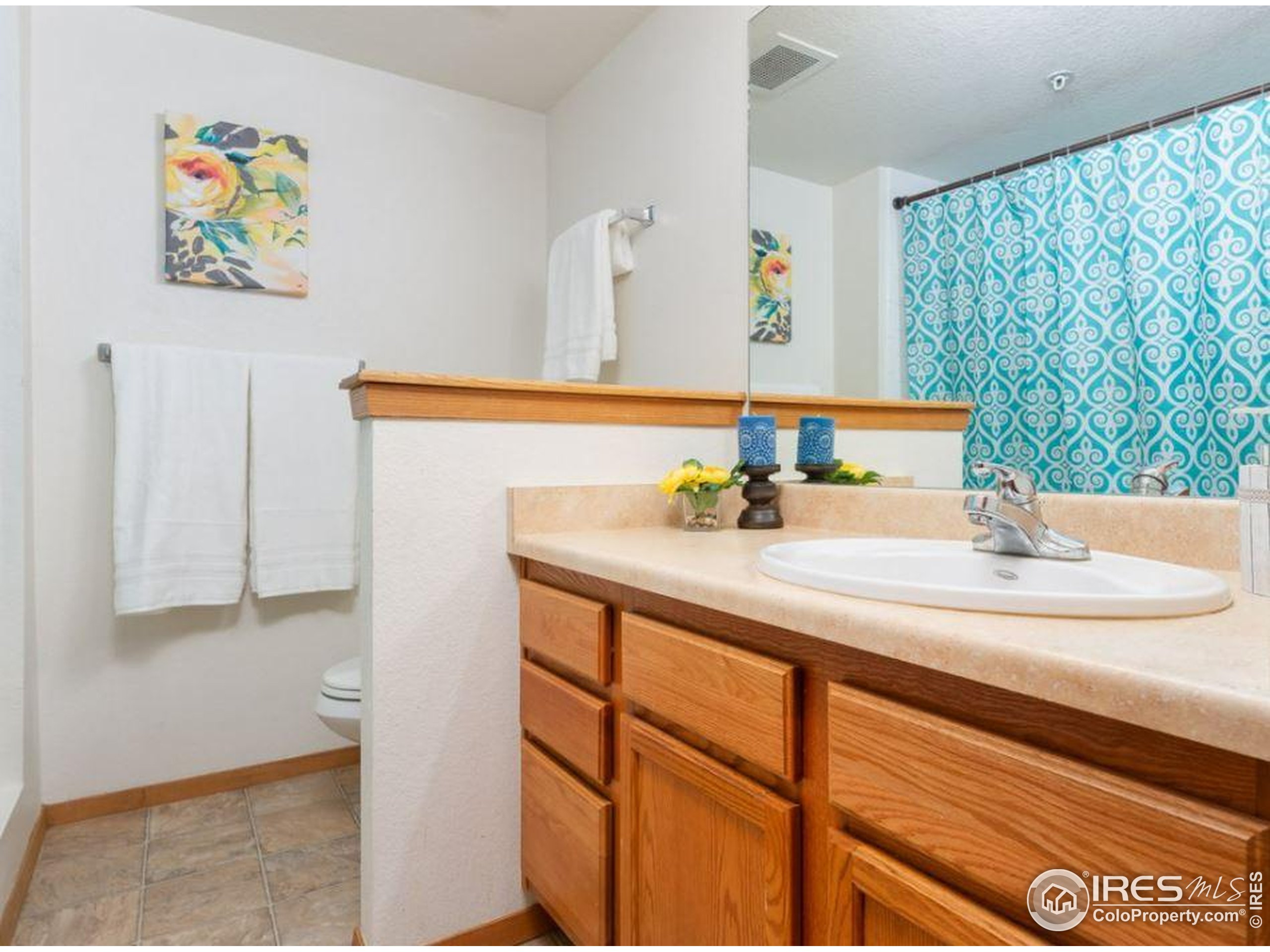 2802 Sundown Lane, Unit 102 Boulder, CO 80303 - Photo 15 of 41 a bathroom with a sink and a mirror