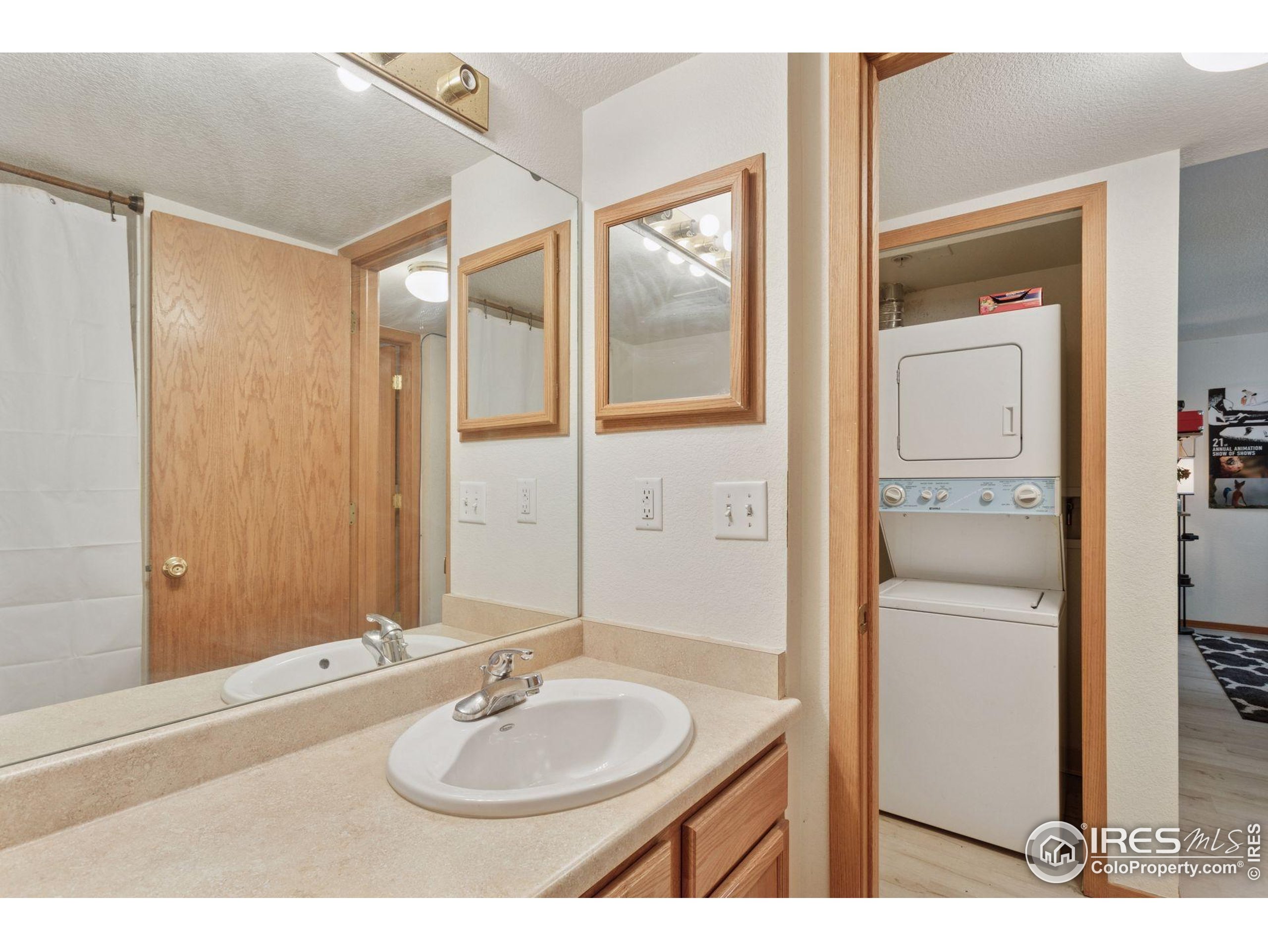 2802 Sundown Lane, Unit 102 Boulder, CO 80303 - Photo 16 of 41 a bathroom with a sink and a mirror