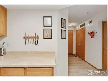 a view of kitchen with furniture and a refrigerator