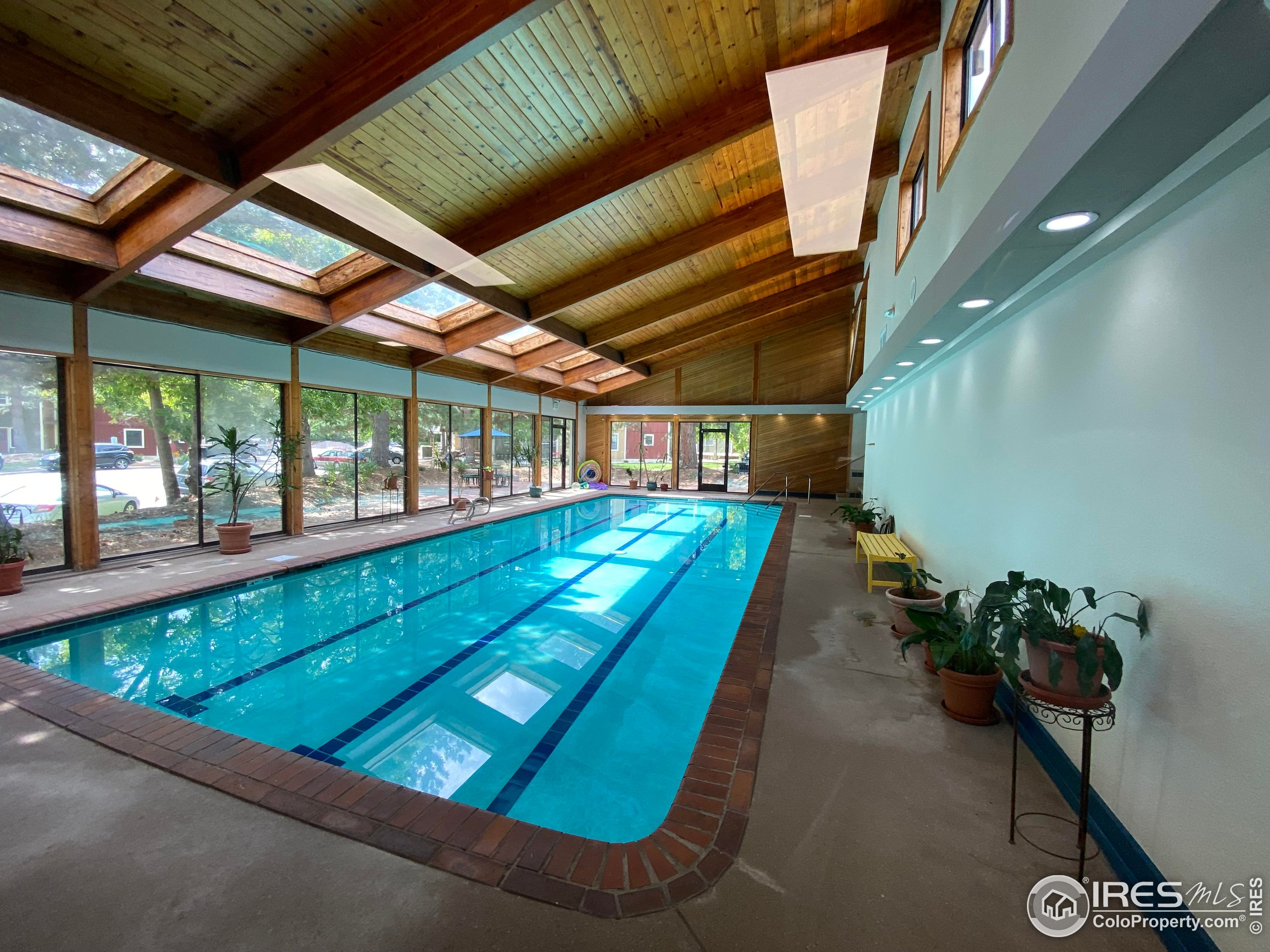 2802 Sundown Lane, Unit 102 Boulder, CO 80303 - Photo 28 of 41 a room with lots of potted plants