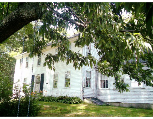 70 Foster Road Ashby, MA 01431 - Photo 1 of 1 a front view of a house with garden