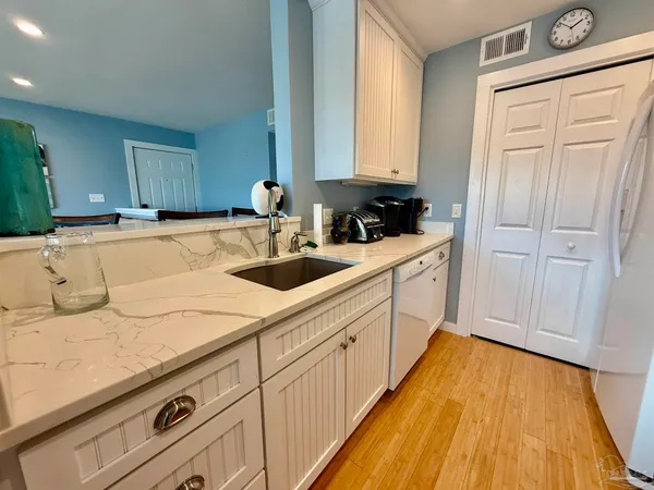 a kitchen with a sink and cabinets