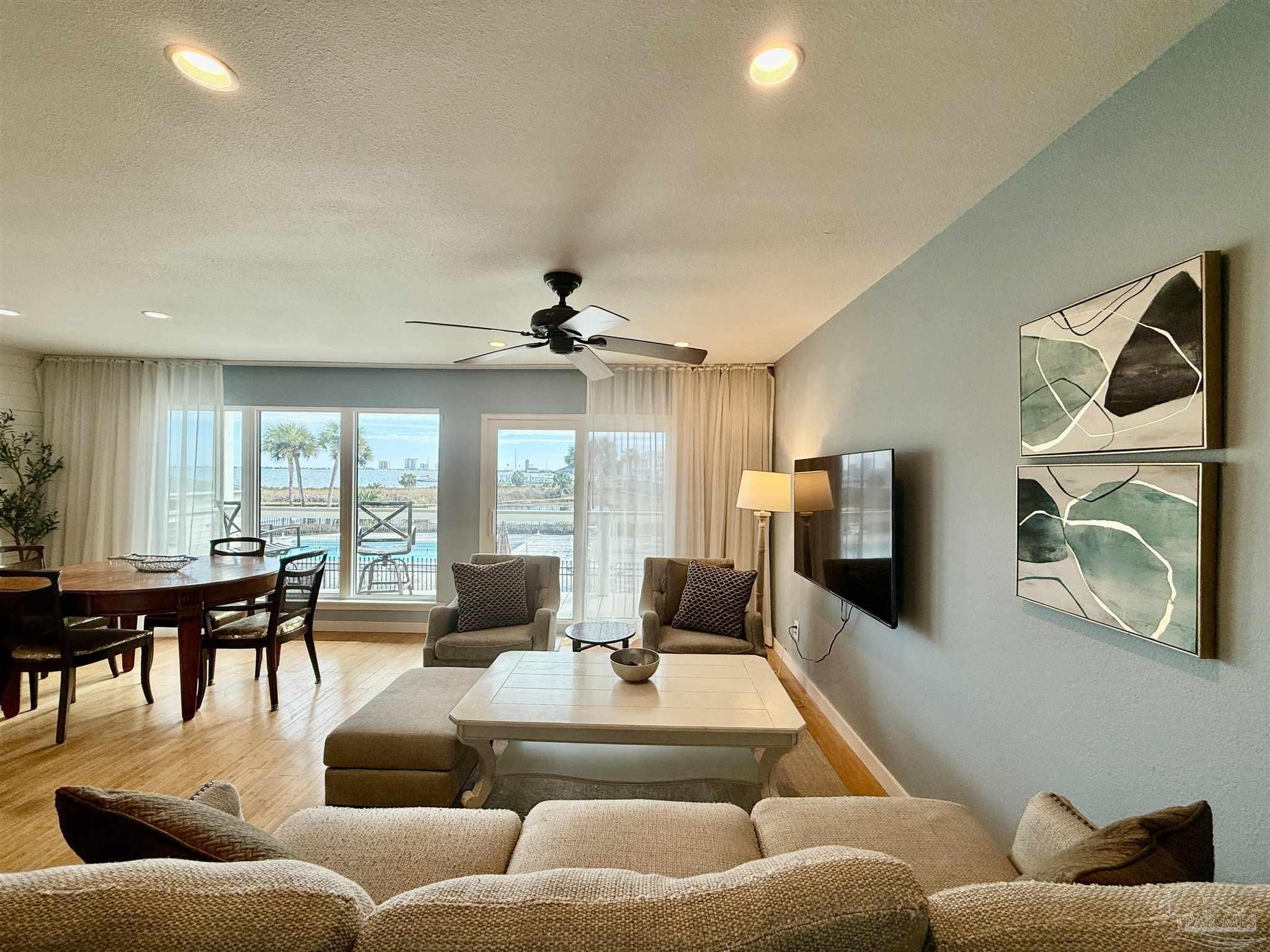 200 Pensacola Beach Road, Unit F3 Gulf Breeze, FL 32561 - Photo 4 of 27 a living room with furniture and wooden floor