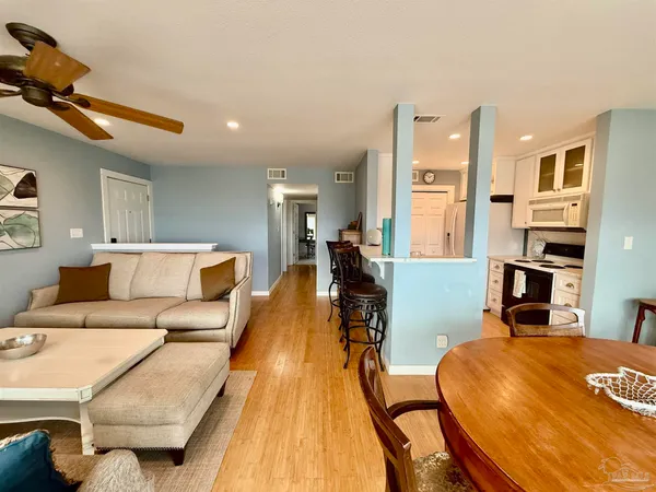 a living room with furniture and a table