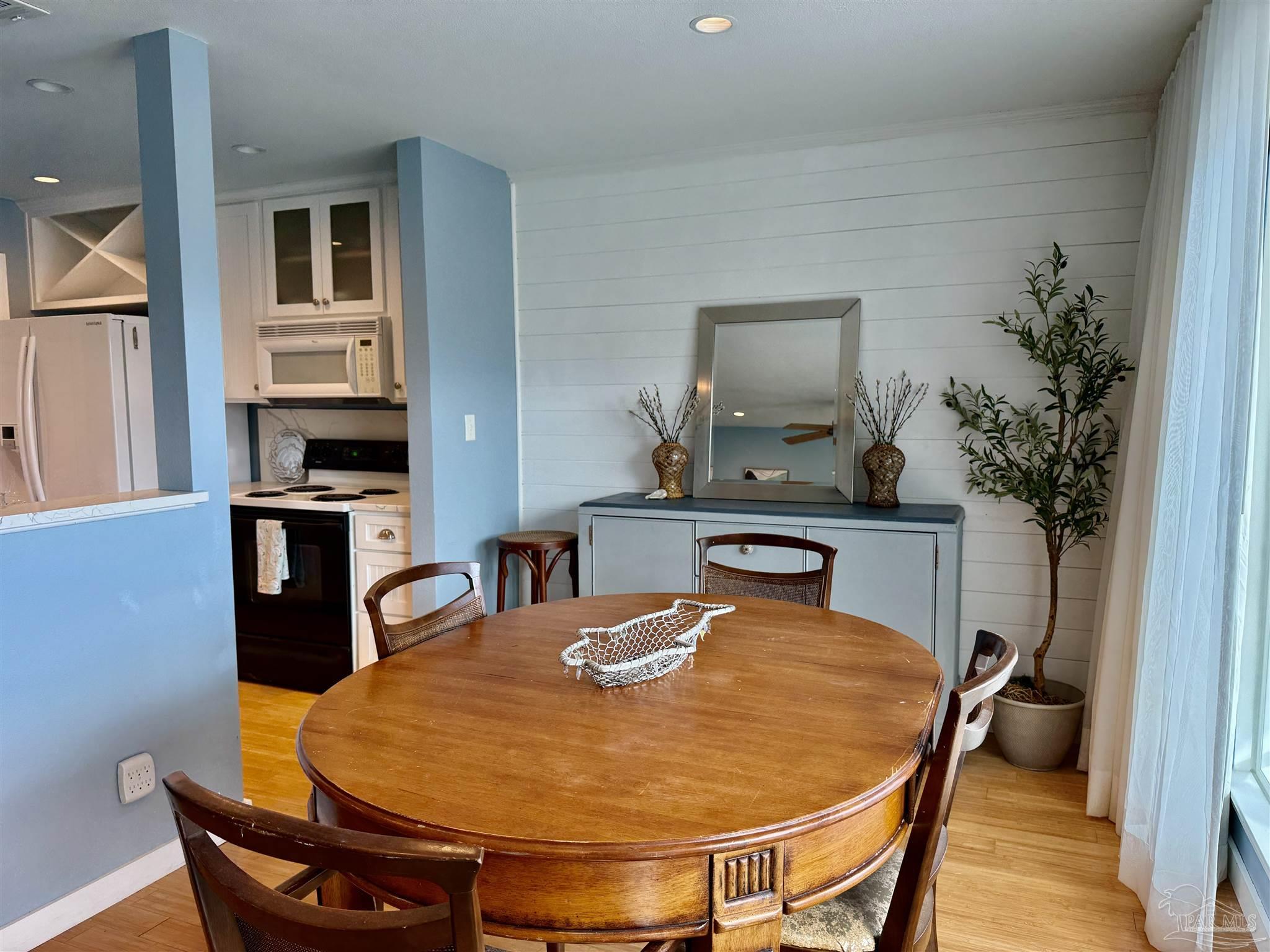 200 Pensacola Beach Road, Unit F3 Gulf Breeze, FL 32561 - Photo 8 of 27 a dining room with furniture and window