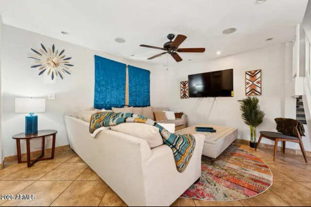 a living room with furniture and a flat screen tv