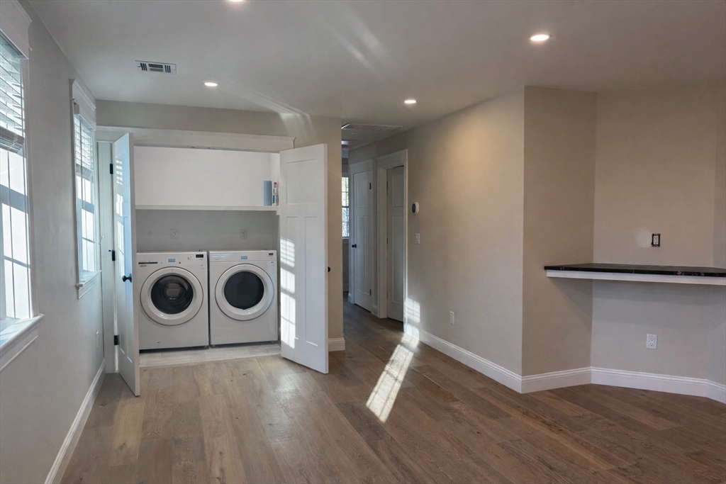1 A Old Mill Road, Unit 2 Maynard, MA 01754 - Photo 3 of 11 a view of a storage and utility room with wooden floor