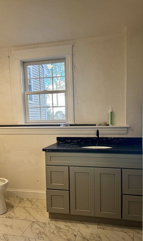 1 A Old Mill Road, Unit 2 Maynard, MA 01754 - Photo 10 of 11 a bathroom with a sink and a toilet
