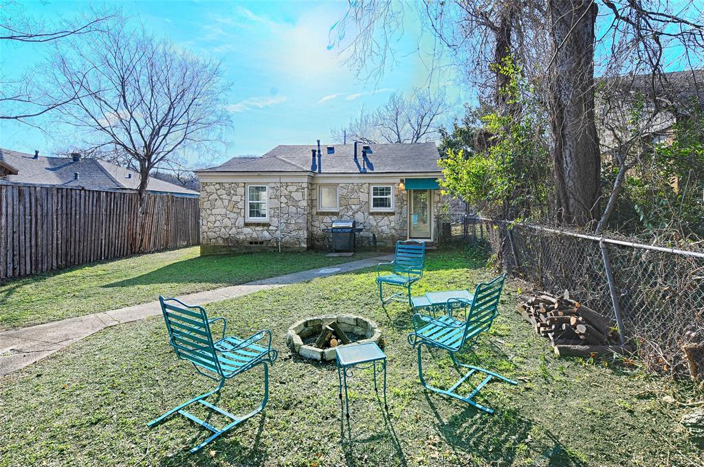 1707 Homewood Place Dallas, TX 75224 - Photo 20 of 21 a view of a chair and table in backyard of the house