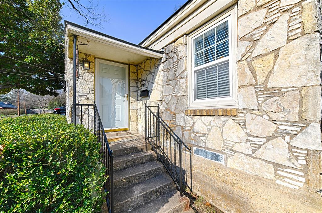 1707 Homewood Place Dallas, TX 75224 - Photo 3 of 21 a view of a house with a small yard and wooden floor and fence