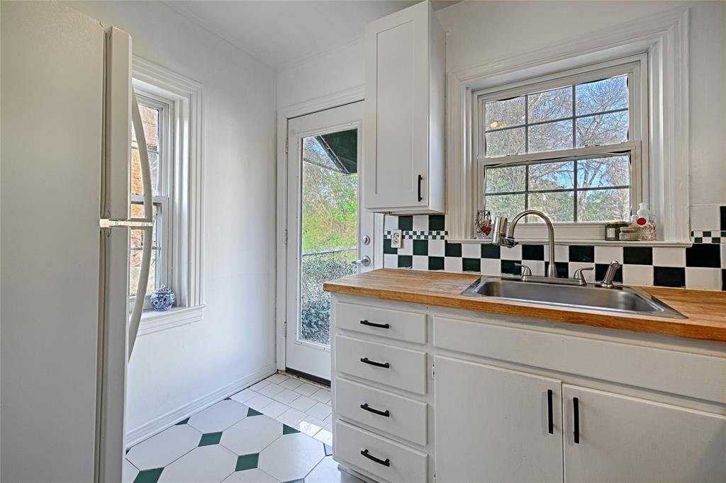 1707 Homewood Place Dallas, TX 75224 - Photo 8 of 21 a kitchen with appliances cabinets and a window