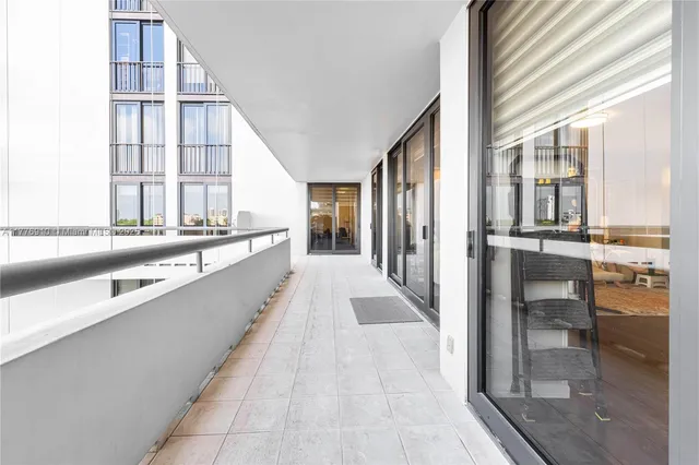 a view of a kitchen with granite countertop a large window