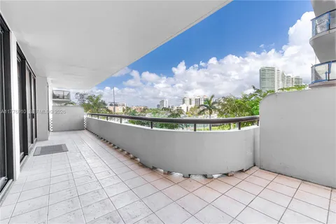 a view of balcony with furniture