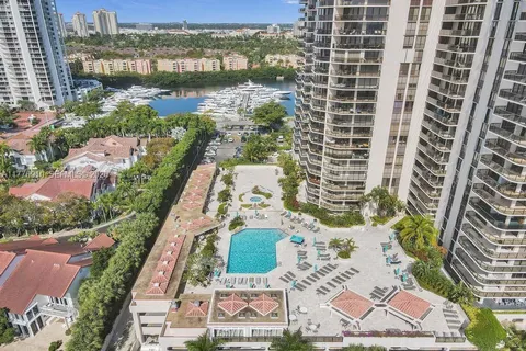an aerial view of residential building and lake view
