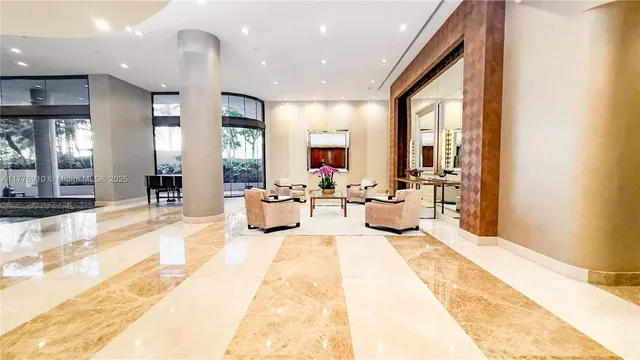 a lobby with furniture and a large window