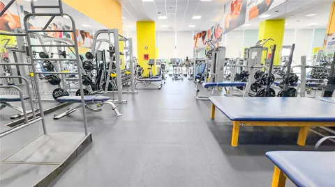a lobby with furniture and a flat screen tv