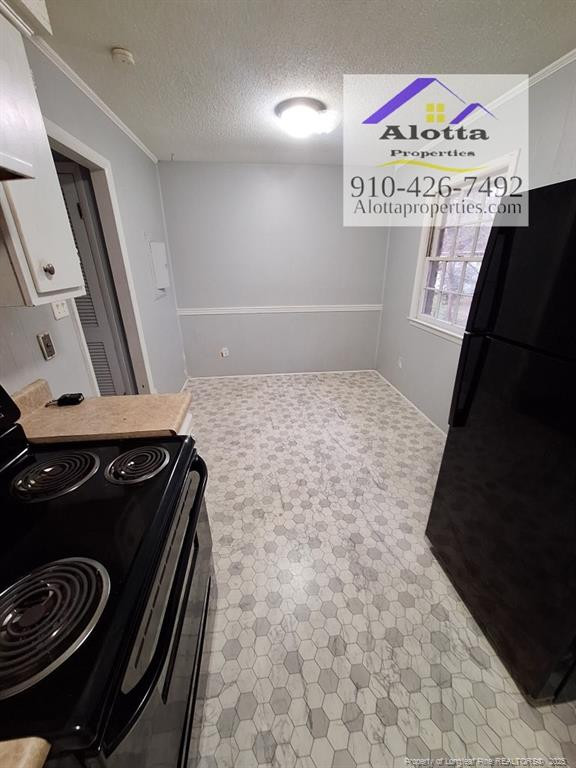 819 Ridge Road, Unit B Fayetteville, NC 28311 - Photo 4 of 7 a bathroom with a granite countertop sink a mirror and vanity