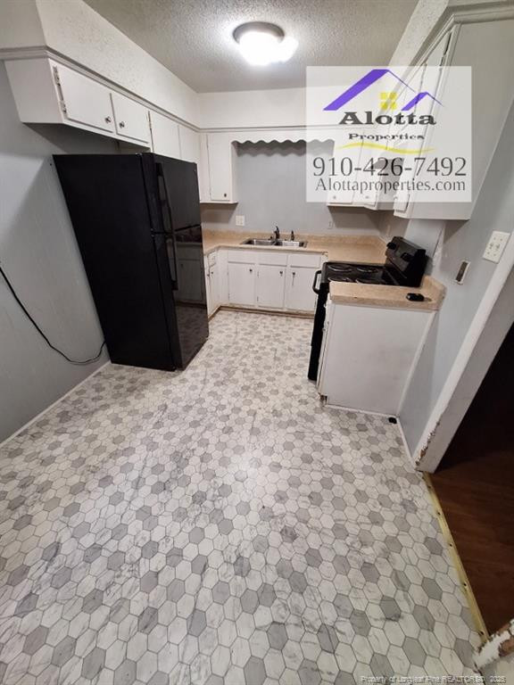 819 Ridge Road, Unit B Fayetteville, NC 28311 - Photo 5 of 7 a kitchen with stainless steel appliances a refrigerator and a stove
