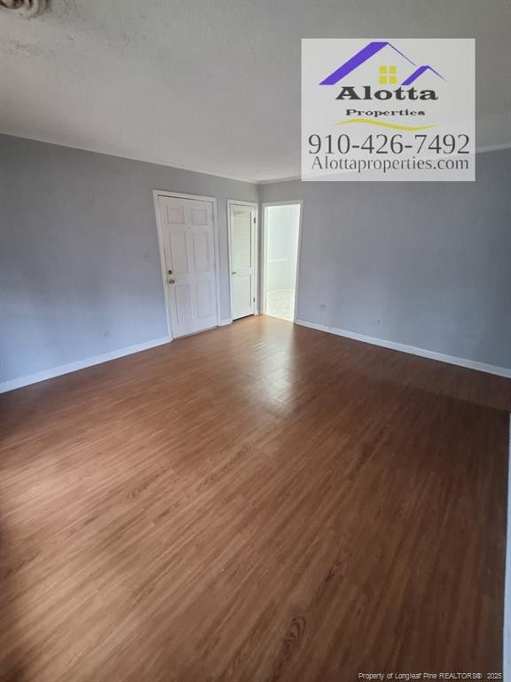 819 Ridge Road, Unit B Fayetteville, NC 28311 - Photo 6 of 7 a view of an empty room with wooden floor and a window