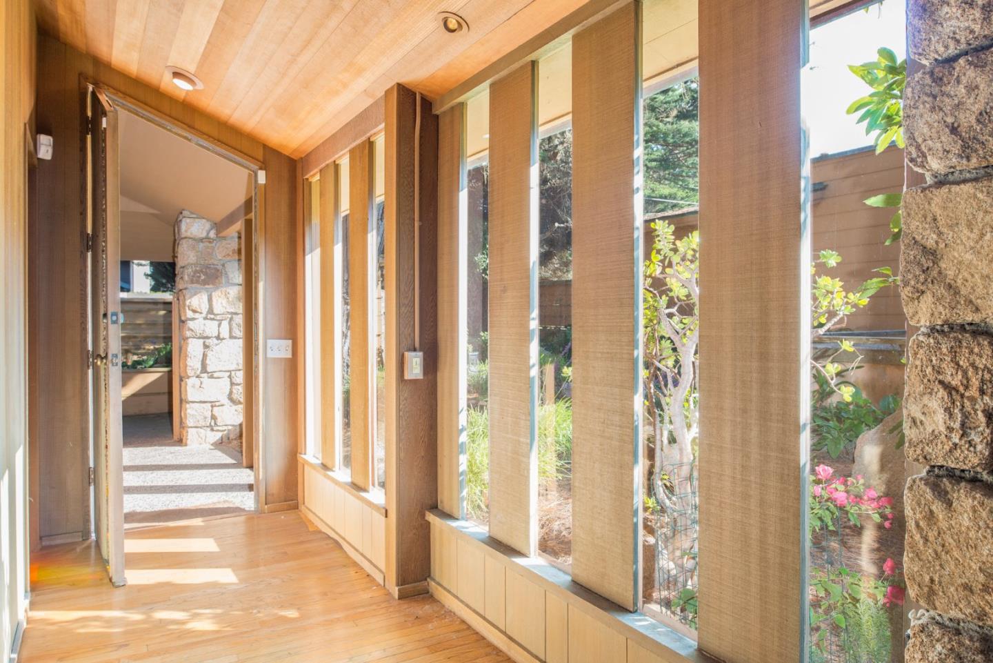 3044 Cormorant Road Pebble Beach, CA 93953 - Photo 13 of 49 a view of a entryway with wooden floor and front door