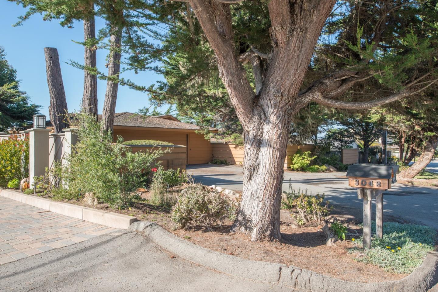 3044 Cormorant Road Pebble Beach, CA 93953 - Photo 2 of 49 a front view of a house with garden