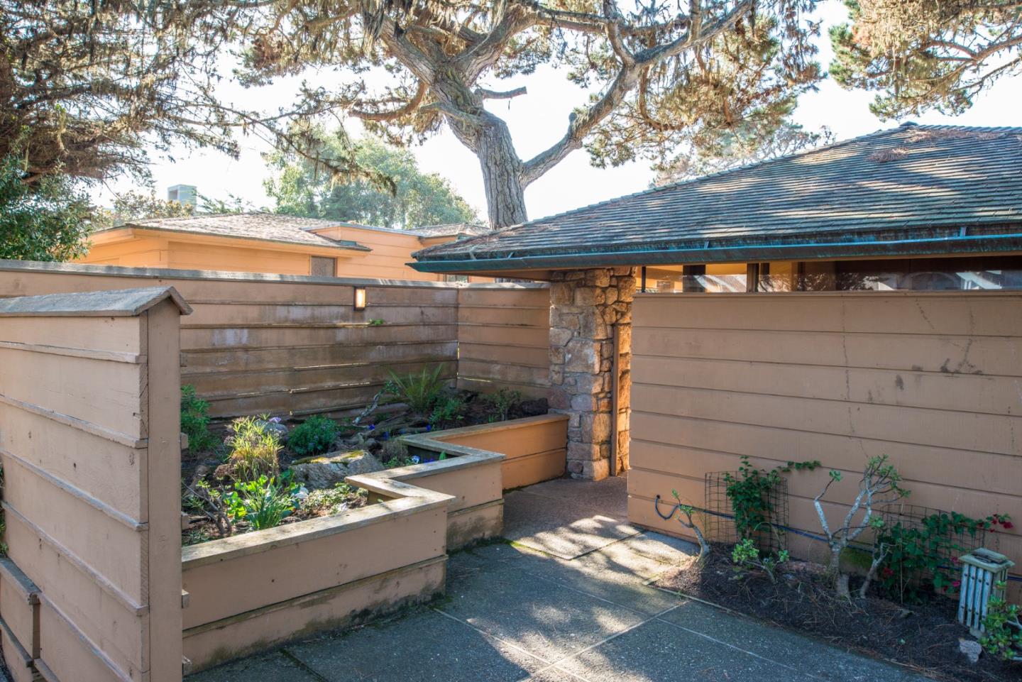 3044 Cormorant Road Pebble Beach, CA 93953 - Photo 3 of 49 a front view of a house with garden