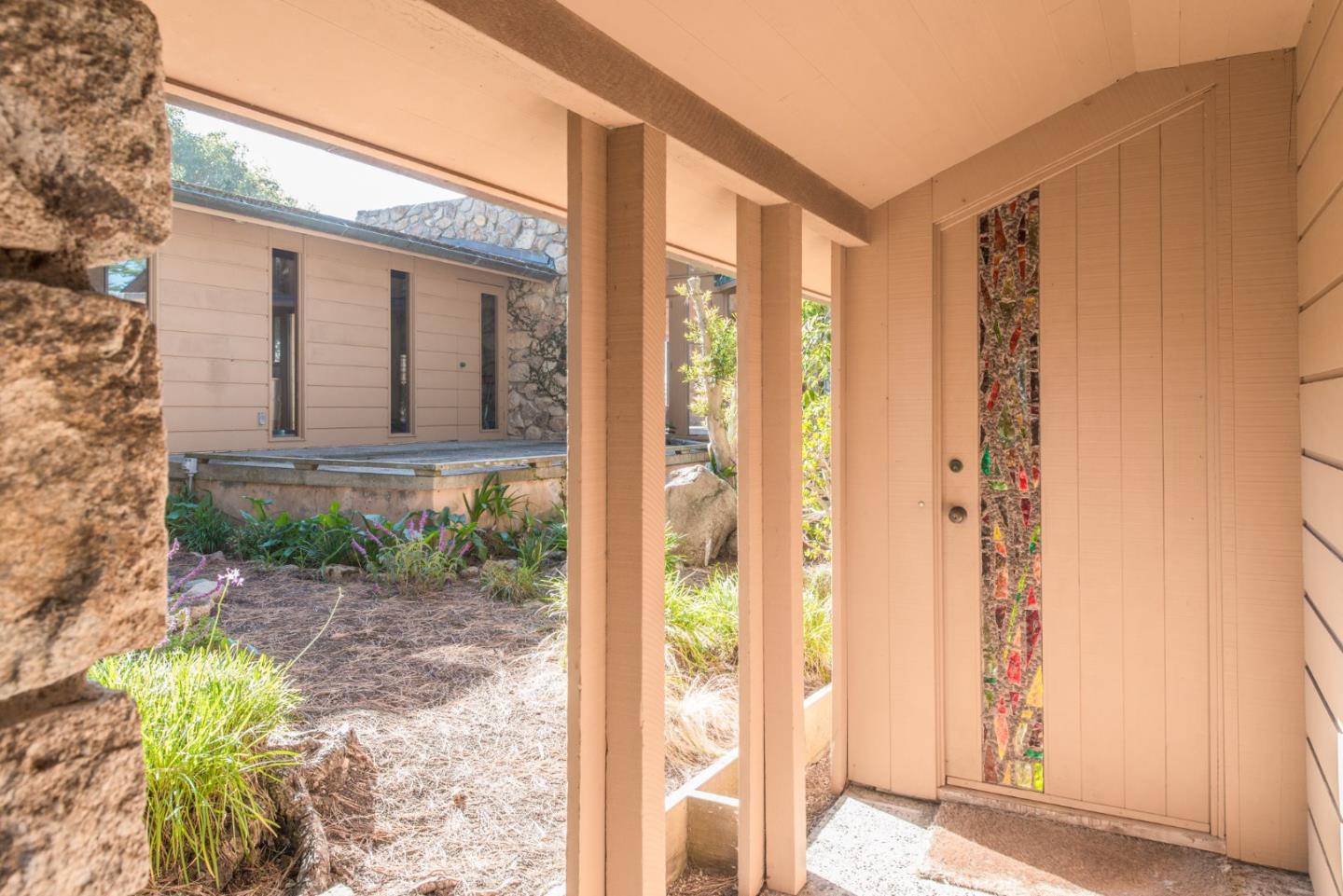 3044 Cormorant Road Pebble Beach, CA 93953 - Photo 4 of 49 a front view of a house with a yard