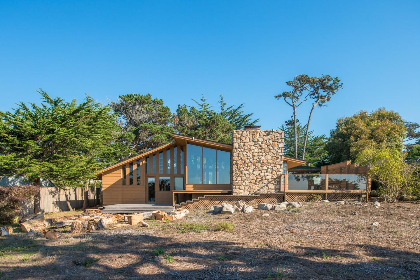 3044 Cormorant Road Pebble Beach, CA 93953 - Photo 10 of 49 a front view of a house with a yard