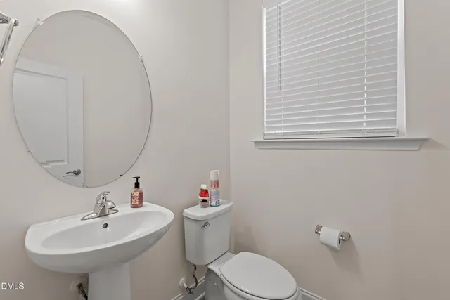 a view of kitchen and dining area with granite countertop stainless steel appliances