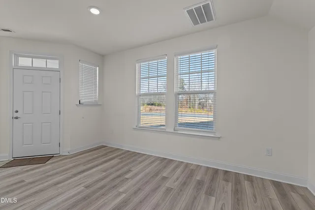 a picture of a bench in front of a wall