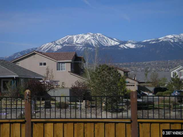 9553 Steep Climb Court Reno, NV 89521 - Photo 2 of 9 a front view of a house with a ocean view