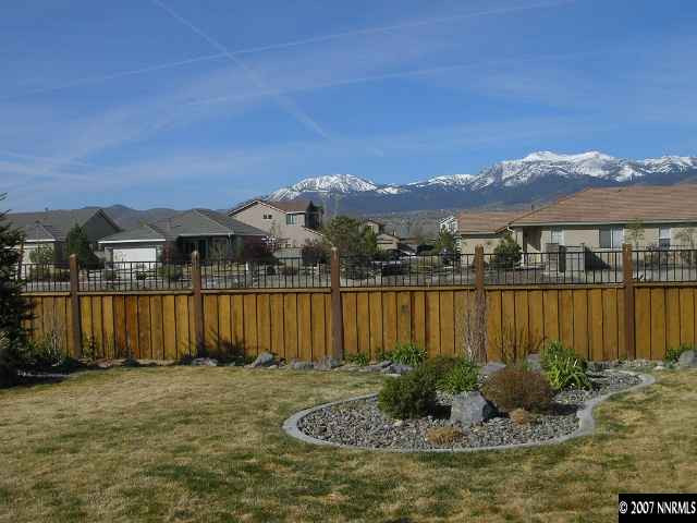 9553 Steep Climb Court Reno, NV 89521 - Photo 3 of 9 a view of a lake with a mountain in the background