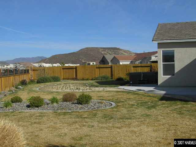 9553 Steep Climb Court Reno, NV 89521 - Photo 4 of 9 a view of a house with a yard