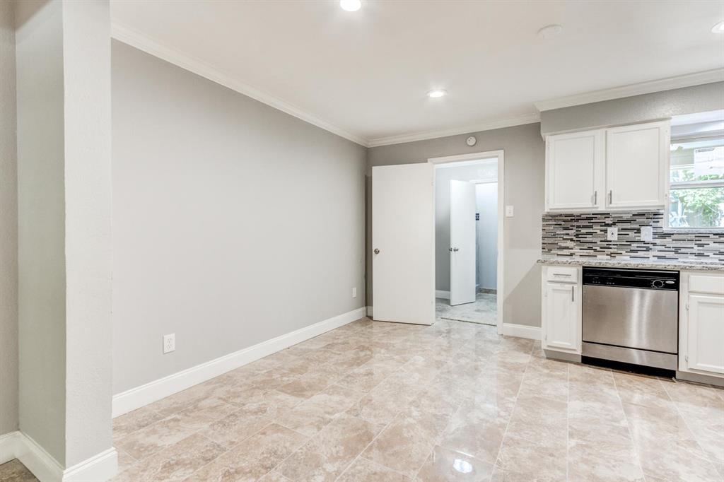 210 Rolston Road, Unit 8 Irving, TX 75060 - Photo 13 of 24 a view of an empty room with a fireplace and window