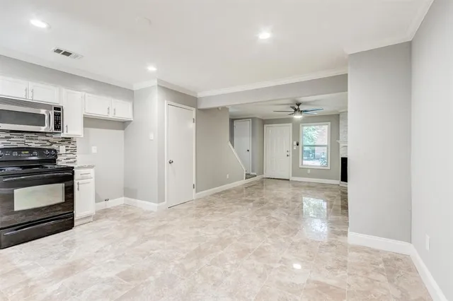a view of a kitchen with microwave and stove