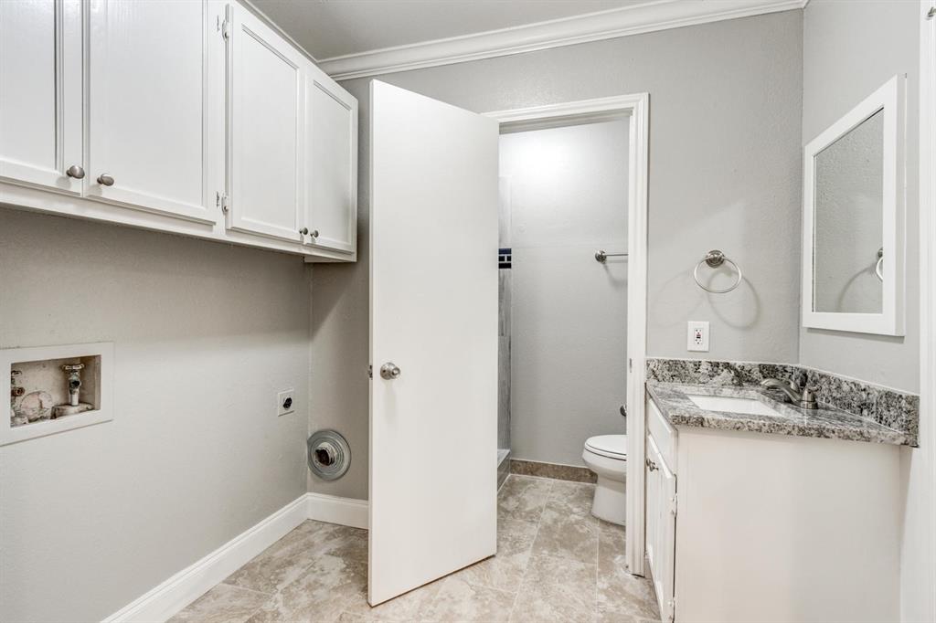 210 Rolston Road, Unit 8 Irving, TX 75060 - Photo 15 of 24 a bathroom with a granite countertop sink and a mirror