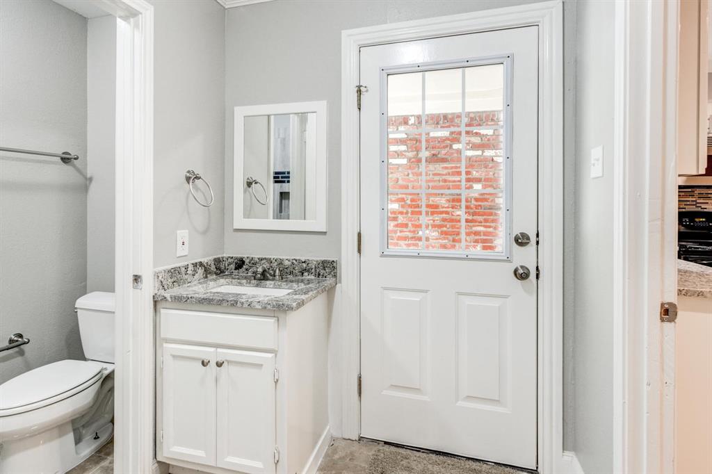 210 Rolston Road, Unit 8 Irving, TX 75060 - Photo 16 of 24 a view of a bathroom with a sink toilet and a window