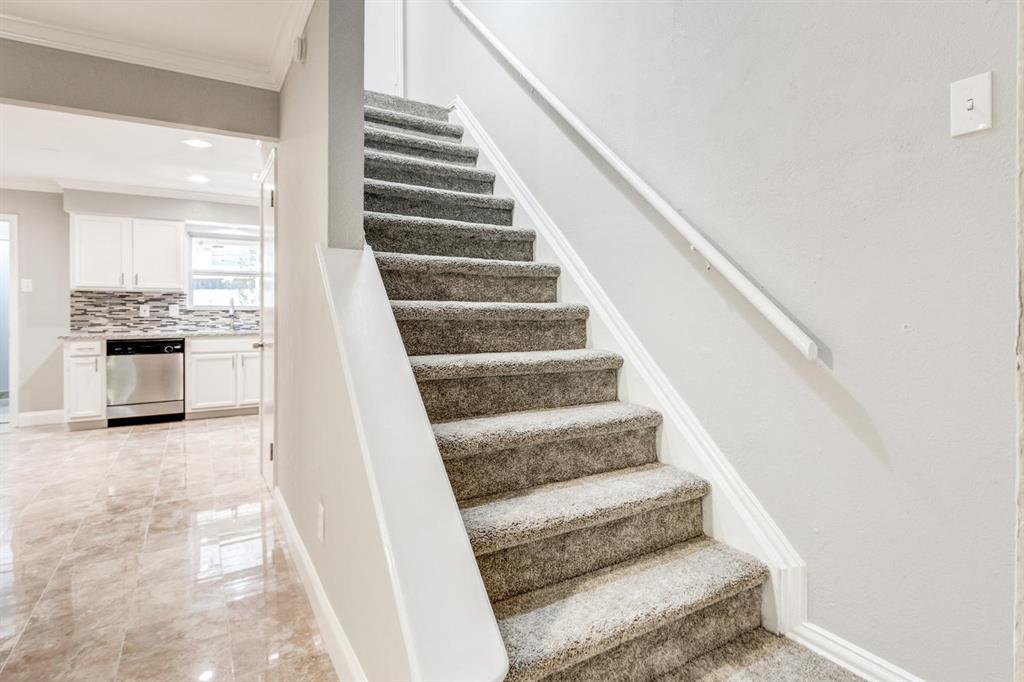 210 Rolston Road, Unit 8 Irving, TX 75060 - Photo 17 of 24 a view of staircase with white walls and windows