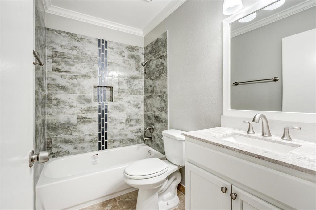 210 Rolston Road, Unit 8 Irving, TX 75060 - Photo 20 of 24 a bathroom with a sink toilet and shower