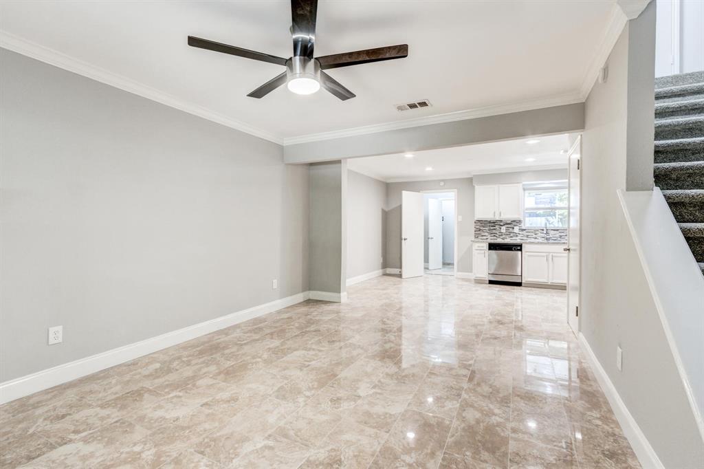 210 Rolston Road, Unit 8 Irving, TX 75060 - Photo 7 of 24 a view of a kitchen with a sink and cabinets