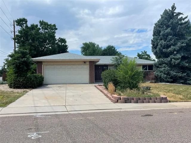 front view of house next to a yard