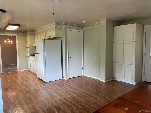 an empty room with windows and entrance