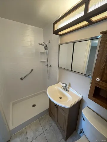 a view of an empty room and a window