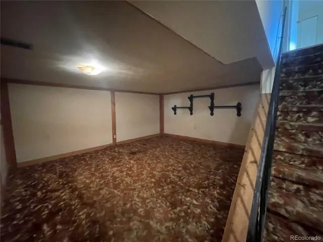 a view of a yard with wooden fence