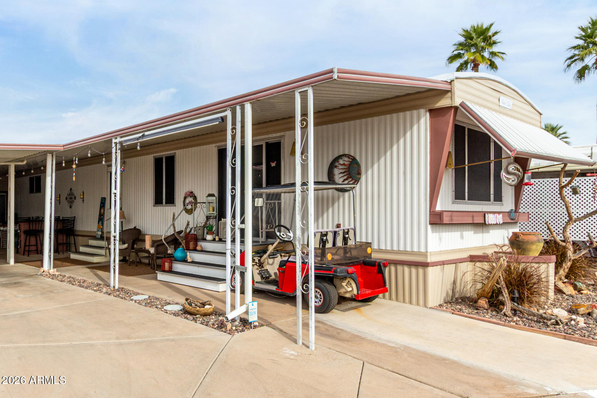 800 West Apache Trail, Unit 93 Apache Junction, AZ 85120 - Photo 15 of 28 a view of a house with tub and chairs