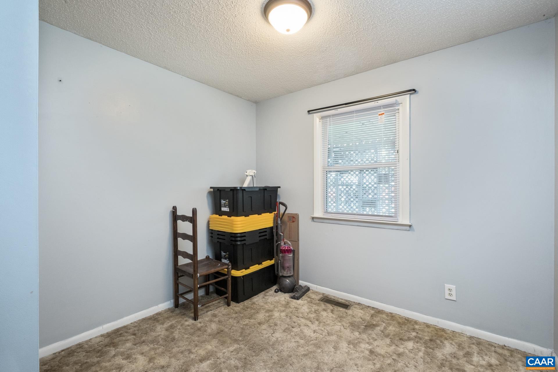 182 Clinton Street Harrisonburg, VA 22802 - Photo 11 of 21 a room with furniture and a window
