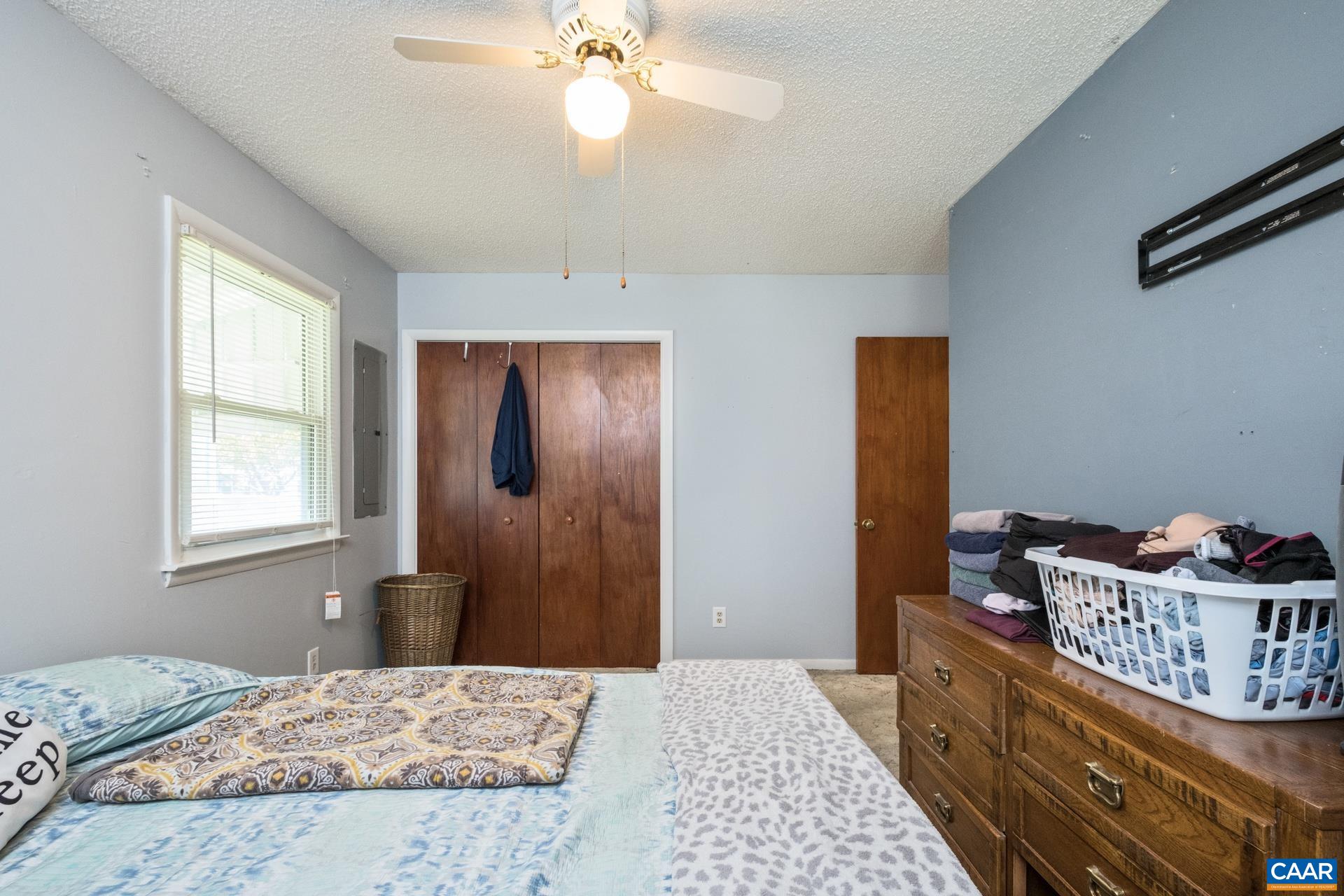 182 Clinton Street Harrisonburg, VA 22802 - Photo 13 of 21 a bedroom with a bed and a dresser