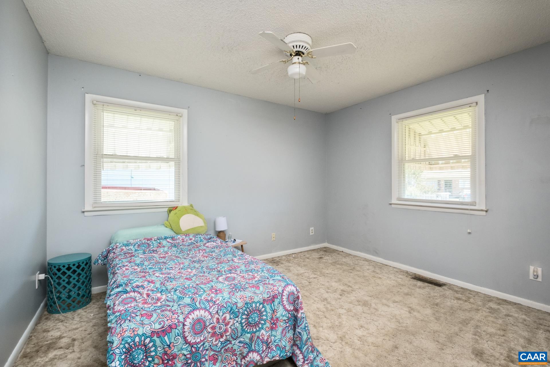 182 Clinton Street Harrisonburg, VA 22802 - Photo 15 of 21 a bedroom with a bed and a window